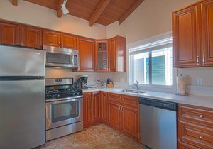 Fantastic and newly-remodeled upper unit just one house from the warm sand