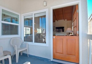 Fantastic and newly-remodeled upper unit just one house from the warm sand