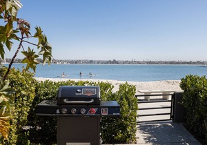 Newly remodeled bayside home directly on the beach with rooftop deck, W/D, & AC