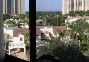 OUTSTANDING LOCATION. End Unit Top Floor Condo near Beach, favored Pelican Bay