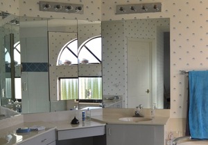 OUTSTANDING LOCATION. End Unit Top Floor Condo near Beach, favored Pelican Bay