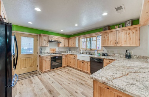 West Village House | Wonderful Retreat Near the Lake W/ Gourmet Kitchen, Free WIFi & Wraparound Deck!