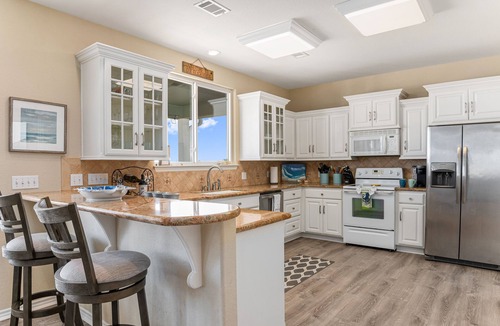 Crystal Beach House | 4-bedroom family home walking distance to the beach. 27 miles of golf cart fun.