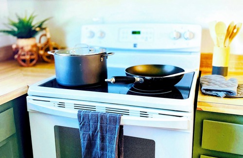Old Station House | Charming 3-bedroom cabin in with AC, spa, game room, firepit & EV charger