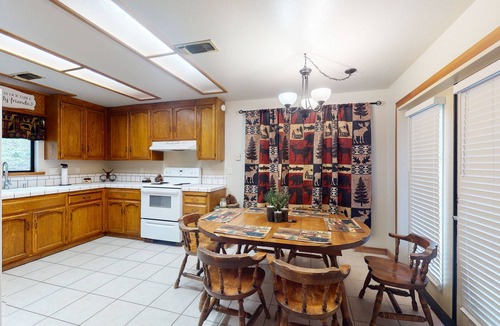 Yosemite Forks Cabin | Charming mountain retreat with wraparound deck, wood stove, & washer/dryer