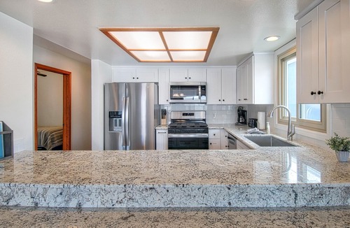 West Newport Condo | Fabulous upper unit on a fabulous street just one house from the beach!