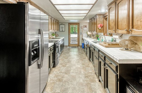 Sierra Cedars House | Idyllic wooded getaway with wraparound deck, WiFi, kayaks & washer/dryer