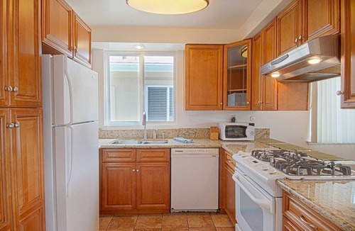 West Newport Condo | Lovely upper unit with amazing balcony for grilling & chilling