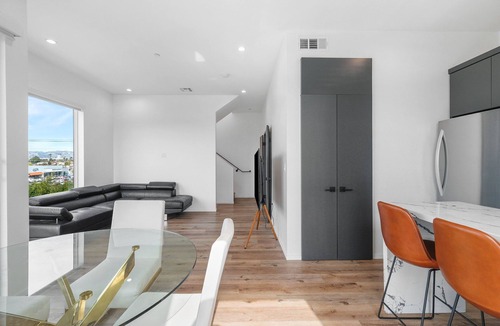 Tri-West Apartment | MidCity 3BR/2BA Townhome with Rooftop, 5 Beds & 2-Car Parking