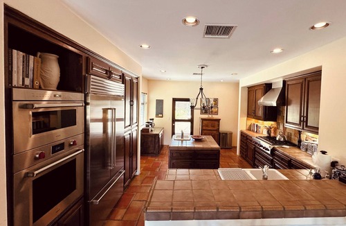 Palm Springs House | Outdoor Shower, Swim-Up Wetbar, Spa, Putting Area, Firepit, EV Charger
