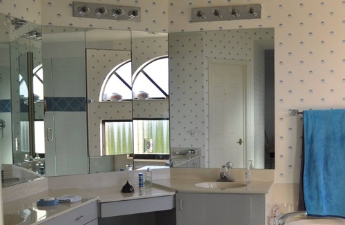 Pelican Bay Condo | OUTSTANDING LOCATION. End Unit Top Floor Condo near Beach, favored Pelican Bay