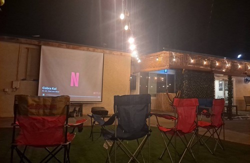 Raisin House | YouTube:TropicalParadiseFresno.Pool/Grill/Outdoor Cinema/OutdoorHeaters.PetFrien