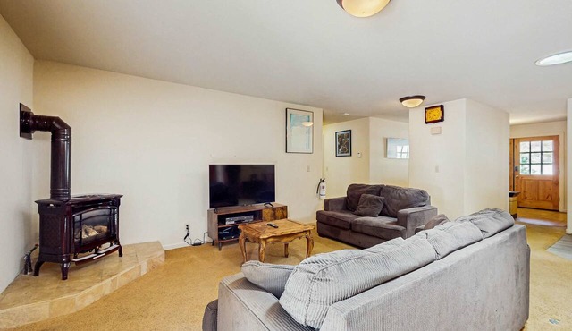 A spacious mountain retreat with a game room, forest views, and easy access to Heavenly and South Lake Tahoe.
