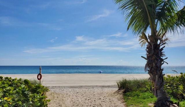 Charming 2-bedroom Luxury Condo on the sand with amazing unobstructed views.