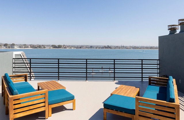 Newly remodeled bayside home directly on the beach with rooftop deck, W/D, & AC