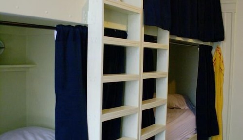1 bed in 4 bed co-ed dorm room with shared bathroom