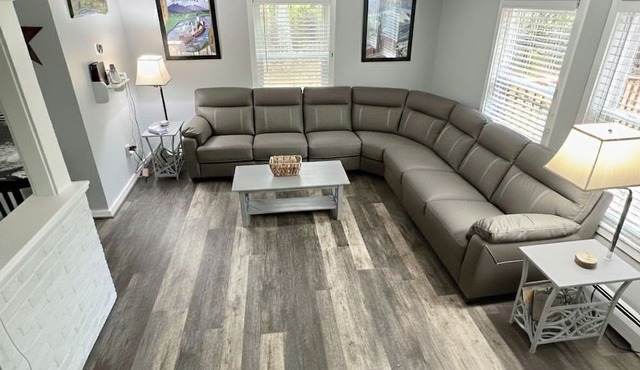 Spacious 3-level AC. home featuring a game room, two family rooms, a fenced yard